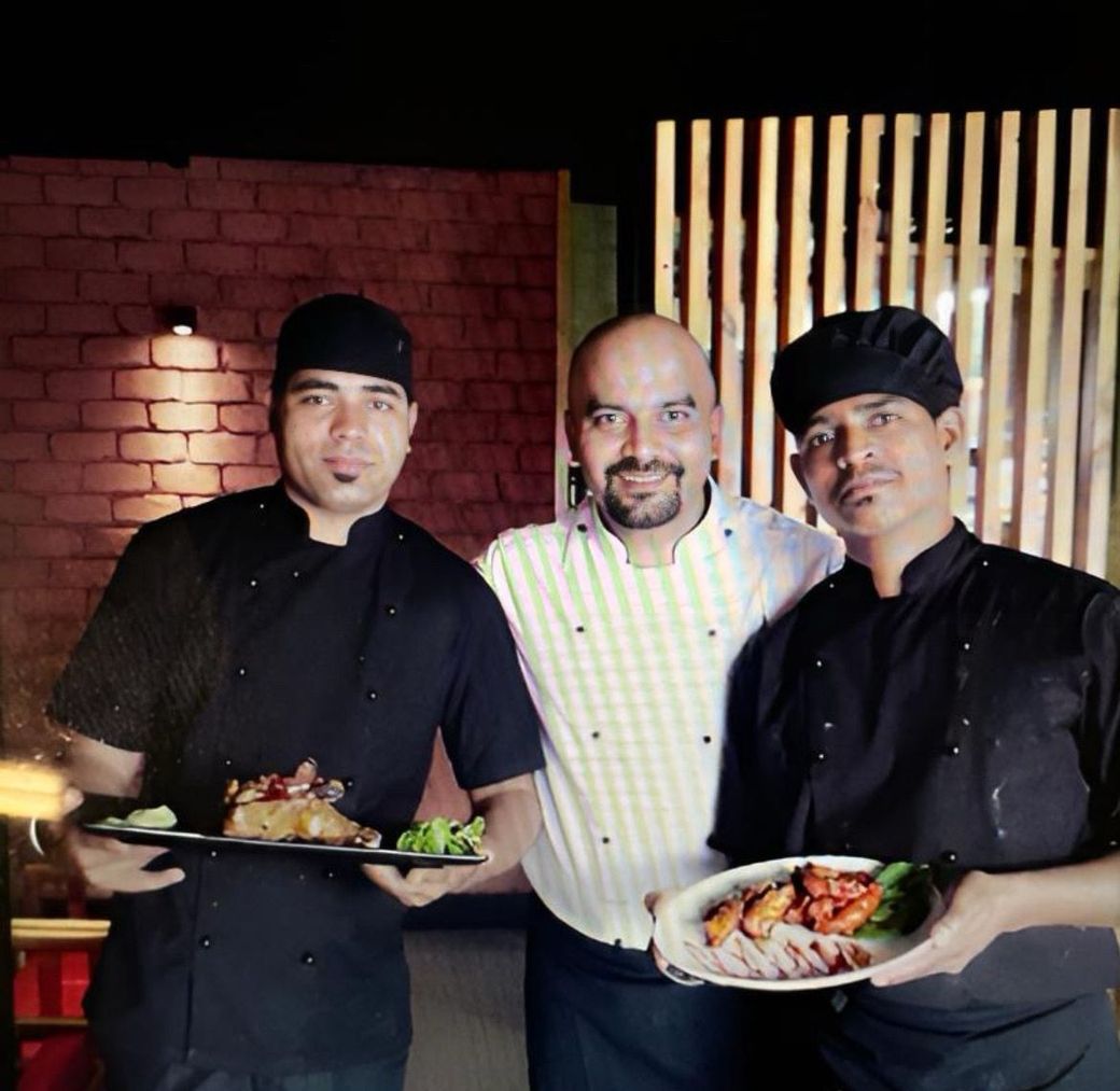 Die Köche Naveen Chand, Raghudev Singh und Surinder Singh
